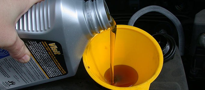 motor_oil_refill_with_funneljpg